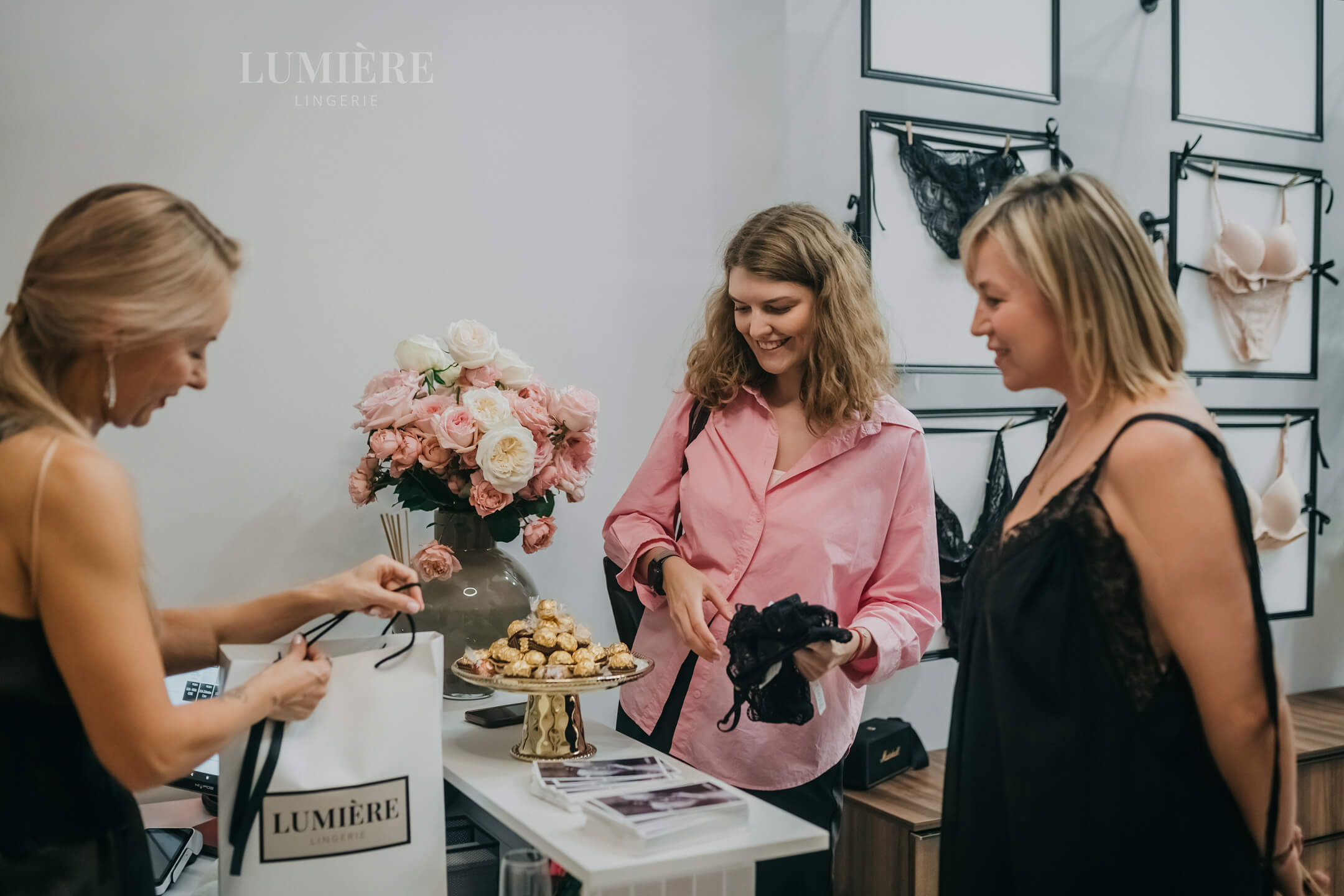 Woman in elegant silk loungewear on Mediterranean terrace overlooking Cyprus sea showcasing luxury lifestyle and climate-appropriate fabric choices at Lumiere